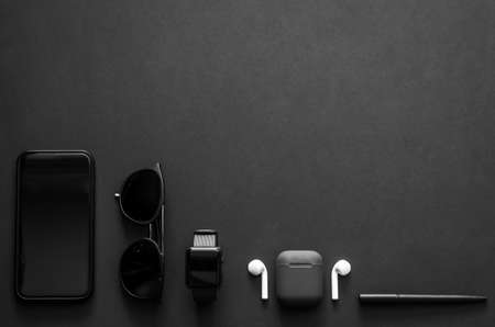 Men gadgets in modern lifestyle on dark background for minimalist flat lay black concept.
の写真素材