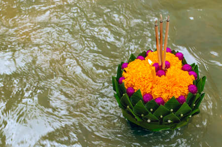 Banana leaf Krathong floating on river for Thailand full moon or Loy Krathong festival.の写真素材