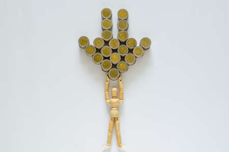 Wood model carrying Thai baht coins that set as down arrow.