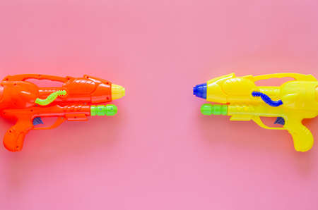 Colorful plastic water gun for Water or Songkran festival on pink background.の写真素材