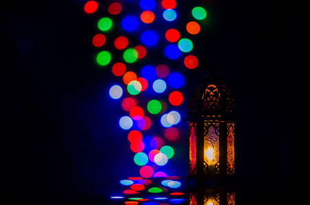 Lantern with colorful bokeh lights for Islamic new year and Ramadan Kareem concept.