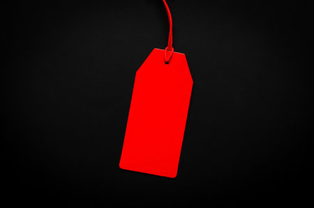 A red blank price tag on black background for shopping and discount on Black Friday concept.の写真素材