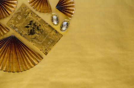 Chinese new year background concept with gold envelope packet or ang bao (word mean wealth) ingots...