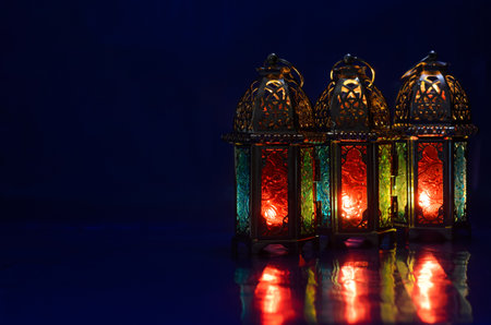 Lanterns put on table with dark blue background for the Muslim feast of the holy month of Ramadan Kareem.の写真素材