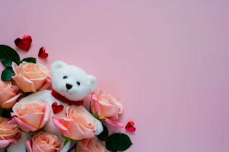 White teddy bear doll with pink roses and love shape on pink background for Valentines day concept.の写真素材