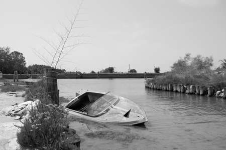 Abandoned boat in the lagoon of Veniceの写真素材