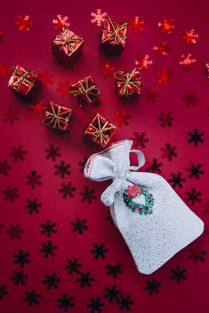 Christmas gifts and 2022 numbers on a red backgroundの写真素材