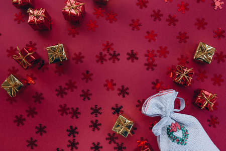 Christmas gifts and 2022 numbers on a red backgroundの写真素材