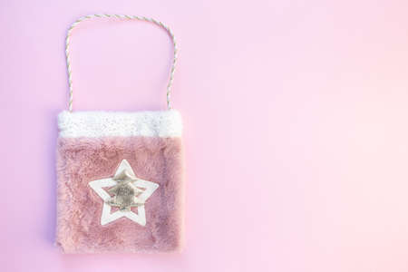 Christmas bag with gifts on a pink backgroundの写真素材