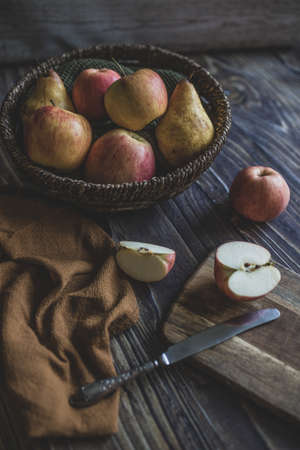 still life apples in a wicker basketの写真素材