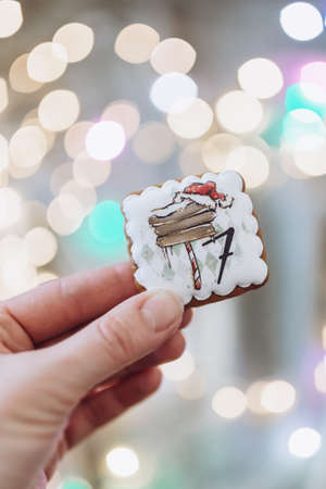 gingerbread advent calendar with numbers on the background of Christmas lightsの写真素材