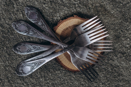 set of silver forks on the tableの写真素材