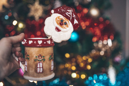 christmas cup in hand of womanの写真素材