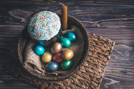 Still life Easter eggs and Easter cake on the table. The concept of home comfort in the bright...