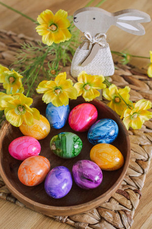 Easter eggs and table decor top view. easter still life with eggs and tulips, easter eggs and tulips...