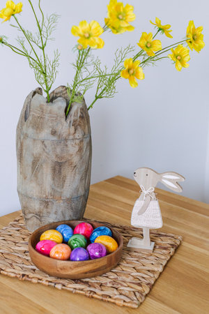 Easter eggs and table decor top view. easter still life with eggs and tulips, easter eggs and tulips...