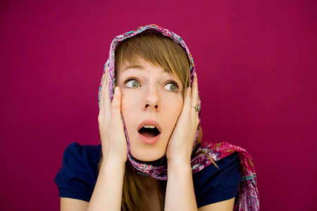 Surprised women with scarf. Looking awayの写真素材