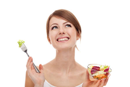 Woman with food looking up. Isolated on white background.の写真素材