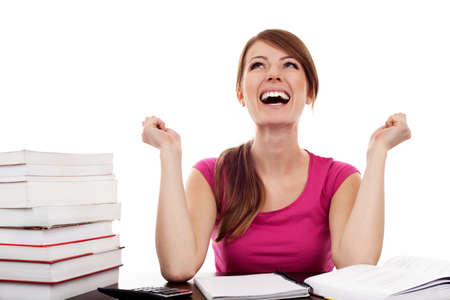 Successful female student with raised arms Isolated on whiteの写真素材