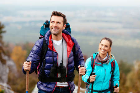 Hikers enjoy the view looking at rocks of Jura, Poland