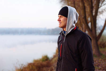 Runner resting after cold autumn runの写真素材