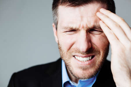 Businessman with headacheの写真素材