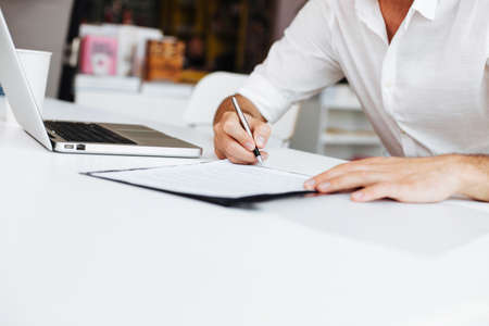 Casual Man signing contract