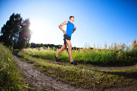 Young man running in countryside. Healthy lifestyle