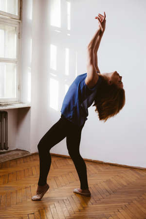 Young female dancer perfecting the poises