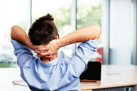 Male professional enjoying a moment of relaxationの写真素材