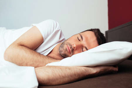 Portrait of a sleeping young manの写真素材