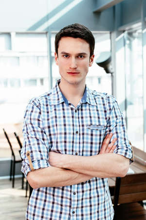 Portrait of a young professional with folded arms