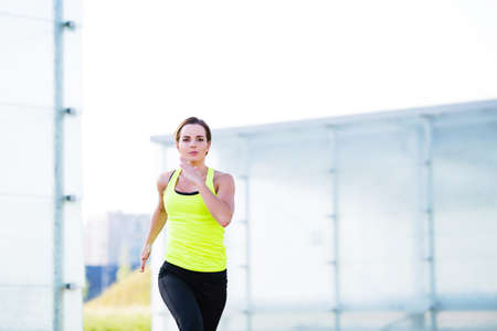 Motivated young woman running