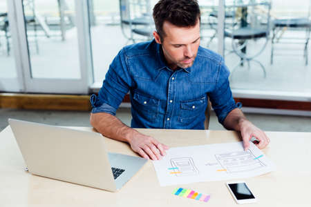 Web designer working on the best framework of a new applicationの写真素材