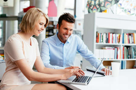 Young professionals in front of a computerの写真素材
