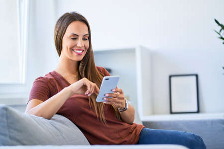 Woman looking at phoneの写真素材