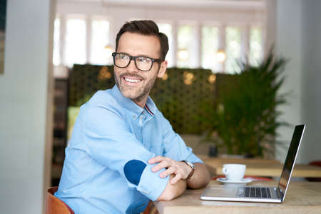Man holding two plates with delicious breakfast. Chef presenting food in restaurantの写真素材