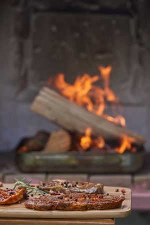 Slices of pork steak ready for barbecue with garlic chillyの写真素材