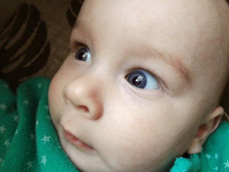 Closeup blue eyes of cute little baby boy.