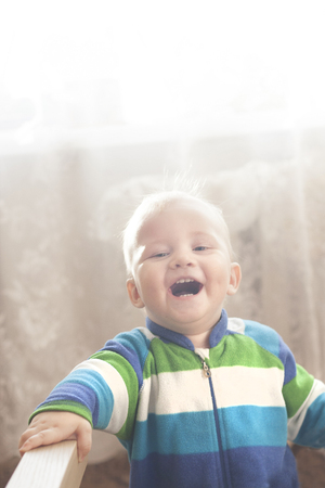 Laughing much toddler with copy-space on top. Portrait orientation.の写真素材
