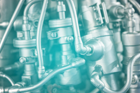 Complex engine background with tubes and pipes toned in blueの写真素材