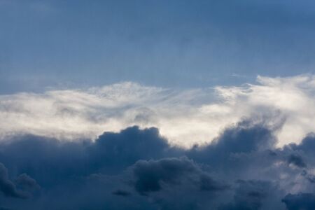 Dark, light and blue clouds in rows