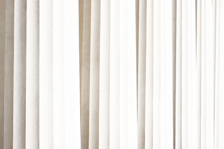Classic antique pillars background. Texture of white greek columns
