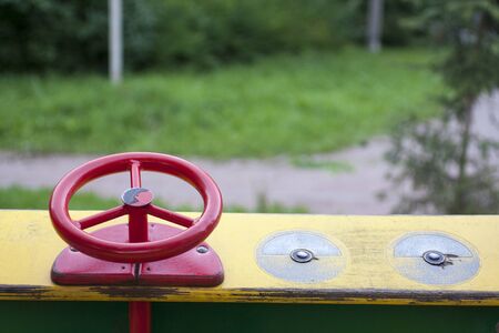 Kid's wooden car on children playground. Driving license conceptの写真素材