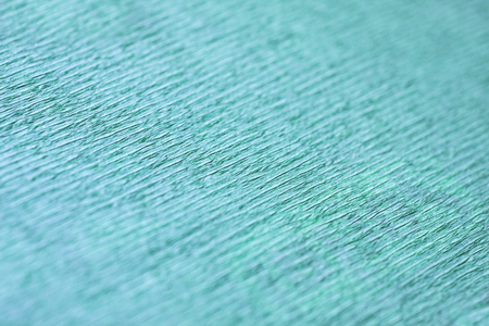 Turquoise wrapping paper texture close up.の写真素材
