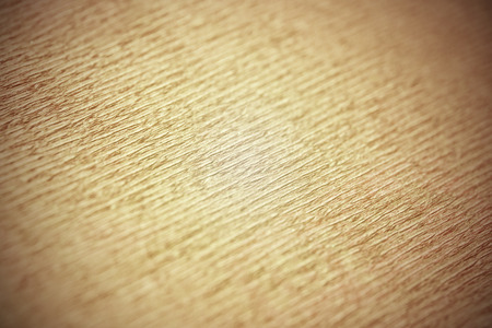 Yellow wrapping paper texture close up. Macro surface of paperの写真素材