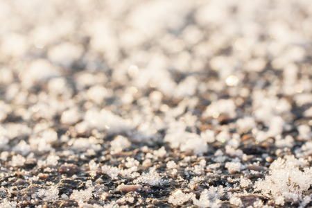Frozen asphalt surface. Snow winter texture macroの写真素材