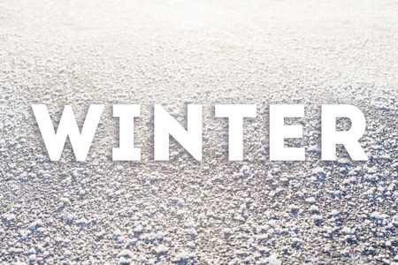 Winter text on frozen surface. Cold weather posterの写真素材