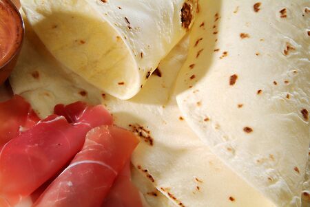 traditional Romagna flatbread and hamの写真素材