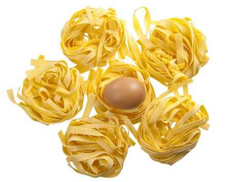 Five nests of egg noodles on white backgroundの写真素材